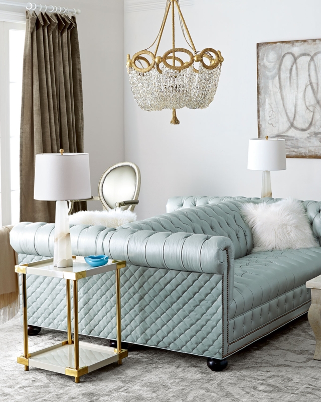 Elegant Tufted Leather Double-Sided Sofa with Gold Accents