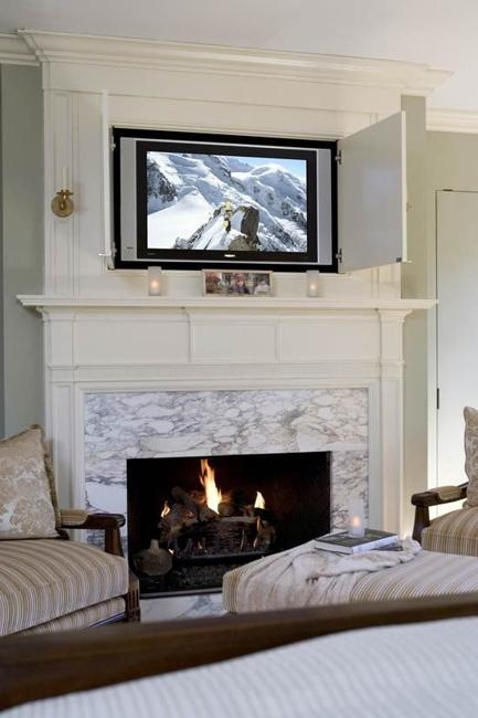 Elegant TV Concealment Behind Fireplace Cabinet Doors