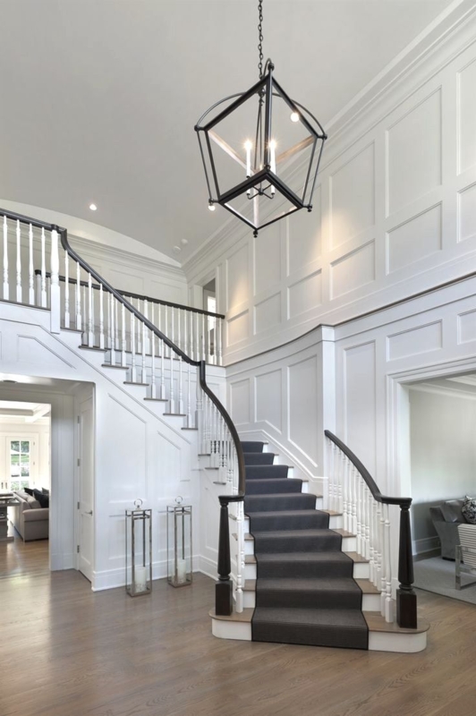 Elegant Two-Story White Foyer with Modern Lantern Chandelier