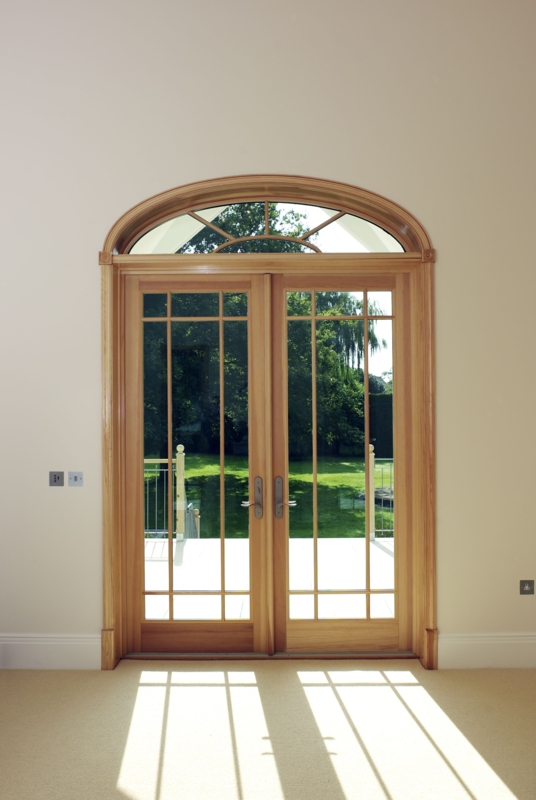 Elegant Wooden French Doors with Arched Transom Window