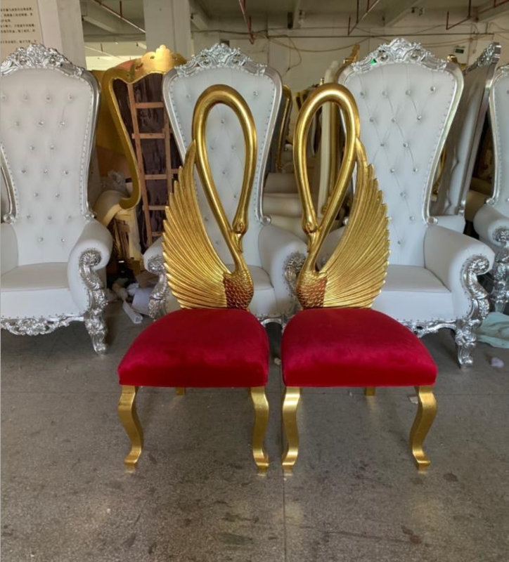 Luxurious Gold Swan Chairs with Red Velvet Seats