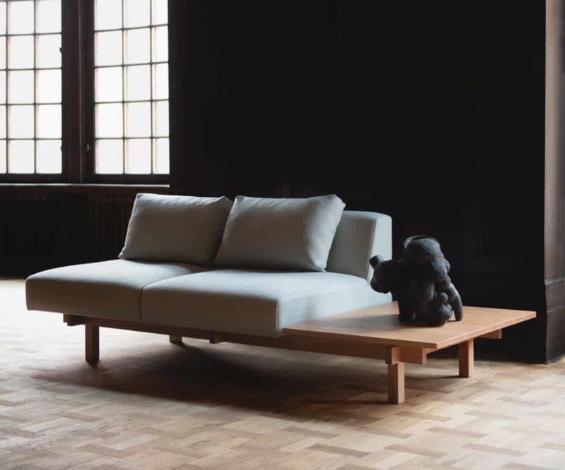 Minimalist Sofa with Integrated Wooden Side Table