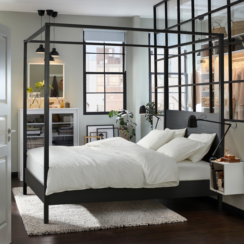 Modern Black Four-Poster Bed with Cozy White Bedding