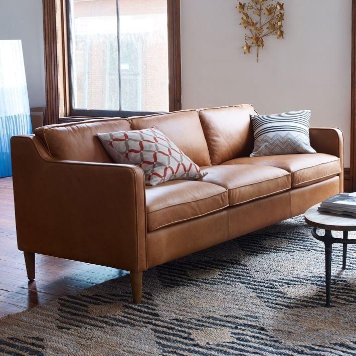 Modern Camel Leather Sofa with Patterned Accent Pillows