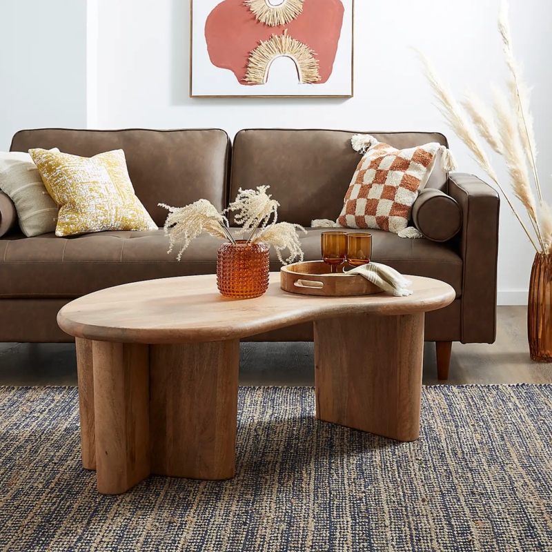 Modern Curved Wooden Coffee Table in Cozy Living Room