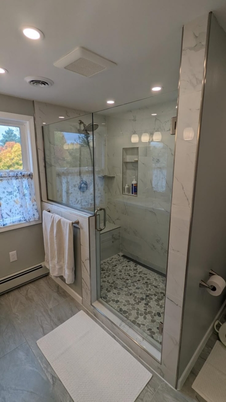 Modern Glass Shower with Half Wall and Pebble Floor
