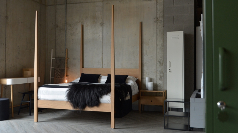 Modern Minimalist Four Poster Bed in Industrial Bedroom