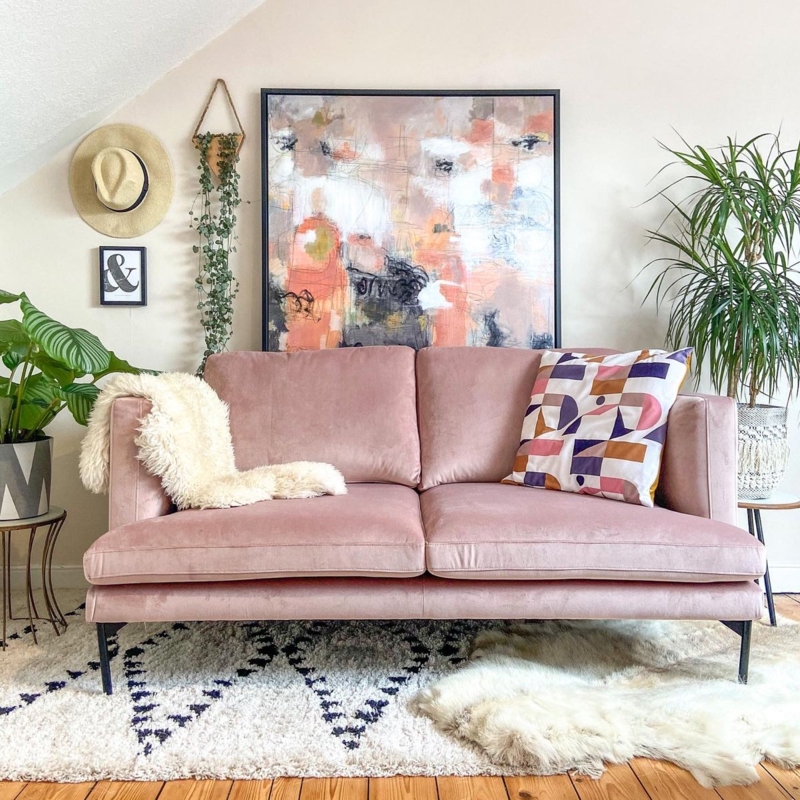 Modern Pink Velvet Sofa with Artistic Wall Decor