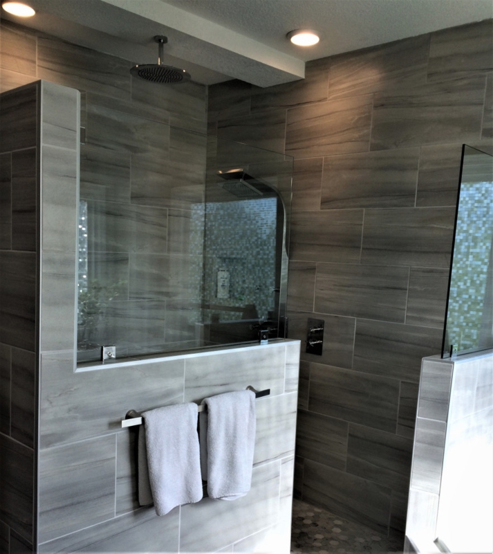 Modern Walk-in Shower with Half Wall and Glass Panels