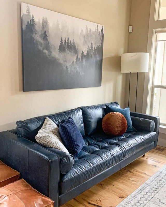 Navy Blue Leather Sofa with Mixed Throw Pillows