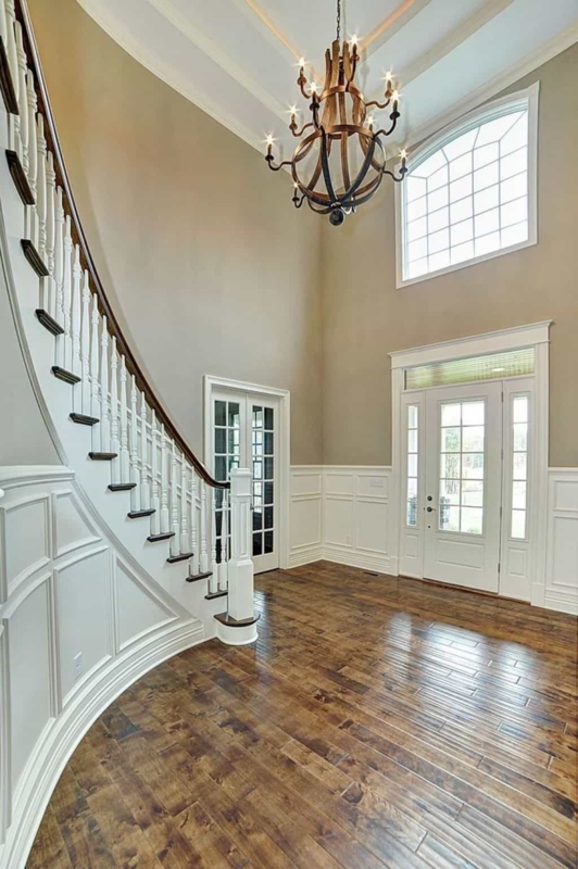 Rustic Chandelier Enhances Two-Story Elegant Foyer