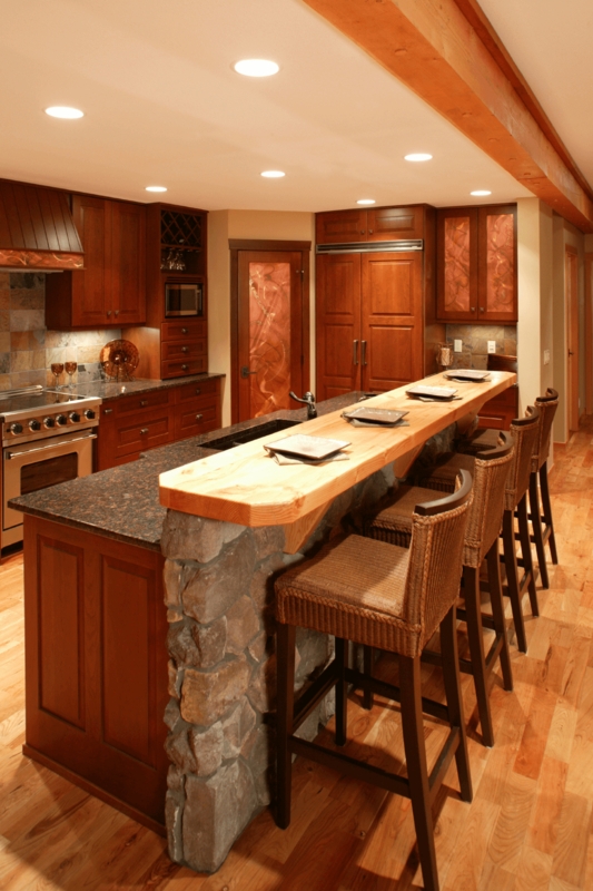 Rustic Kitchen Island with Stone Base and Wood Countertop