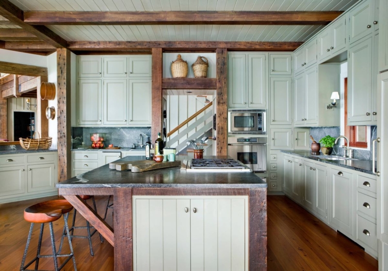 Rustic Kitchen Island with Wooden Beams and Stone Countertop