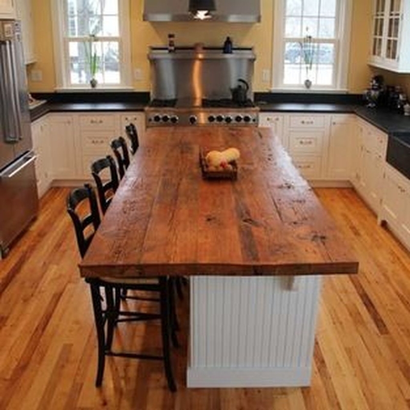 Rustic Wooden Kitchen Island with Black Chairs