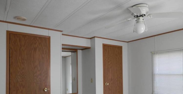 Simple Gypsum Ceiling Panels and Wood Doors in Mobile Homes