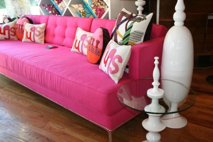 Vibrant Hot Pink Couch with Colorful Accent Pillows