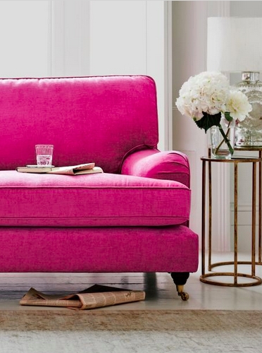 Vibrant Pink Sofa with Elegant Accent Table