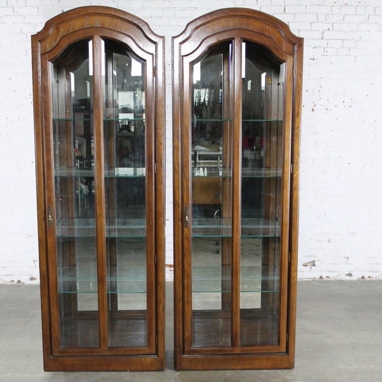 Vintage Pair of Lighted Dark Wood Curio Cabinets