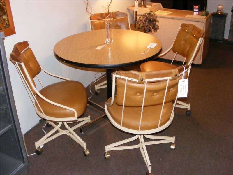 70's Sleek Modern Swivel Rolling Dining Chairs! Shown with round oak ...