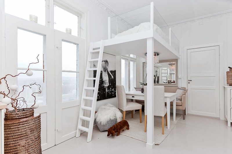 Bright Loft Bed with Glass Railings in Small Space