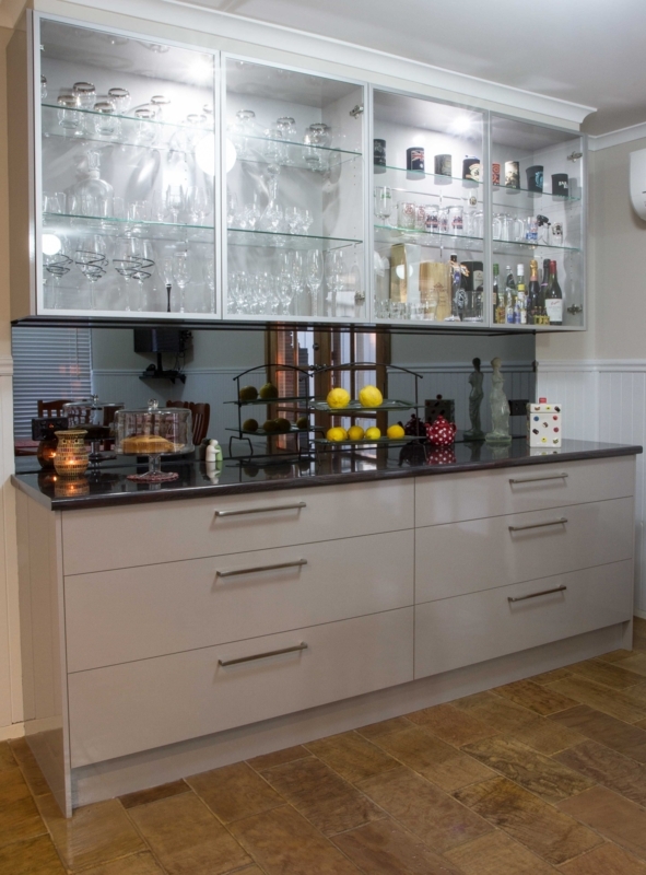 Buffet bar. Glass overhead cabinet doors. Smoked mirror splashback. www ...