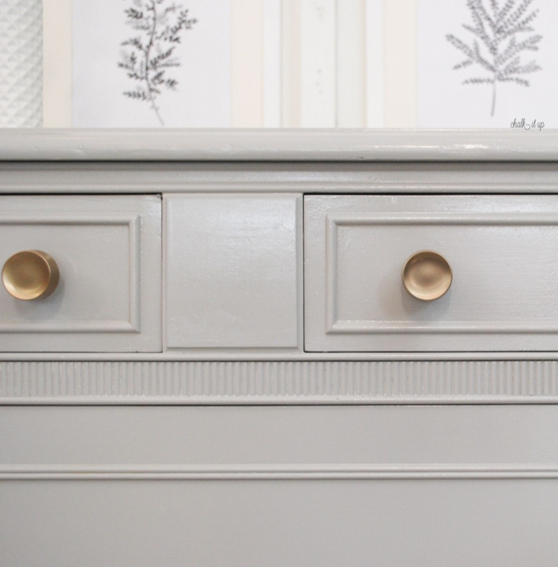 Champagne Bronze Drum Knob on Light Gray Drawer