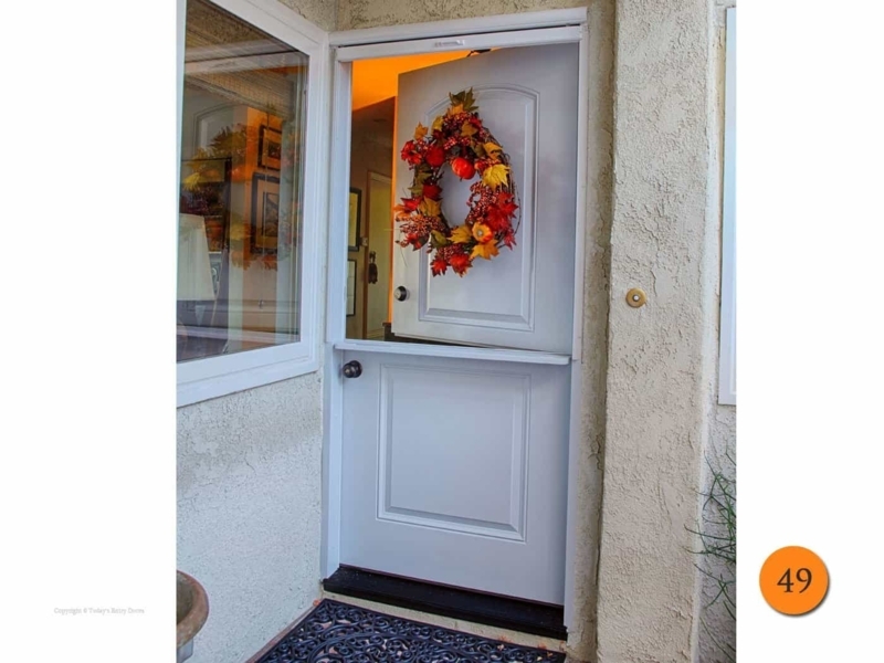 Charming Screened Dutch Door with Seasonal Wreath