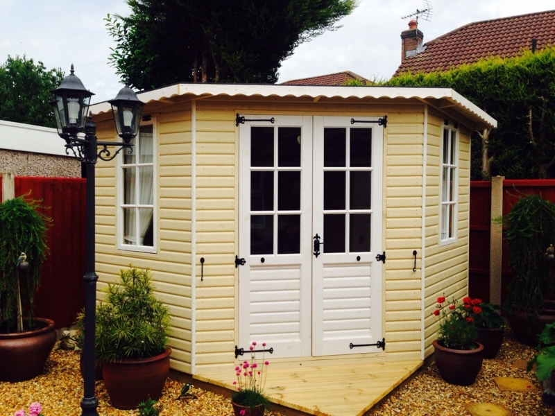 Charming Yellow Garden Shed with White Doors