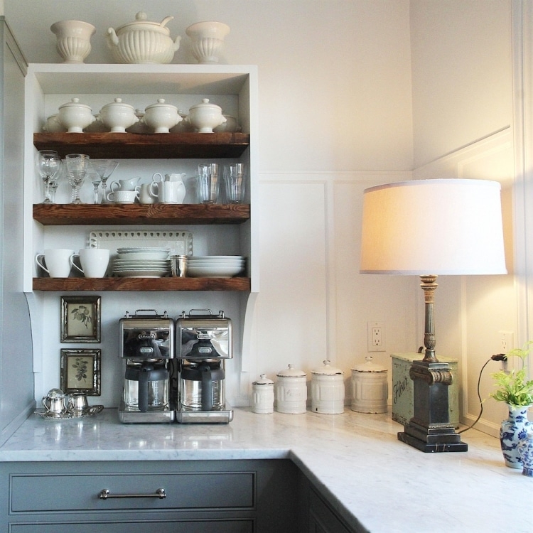 Classic Kitchen Counter with Vintage Lamp and Shelves