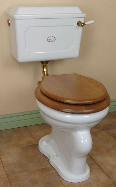 Classic Vintage Toilet with Wooden Seat and White Tank
