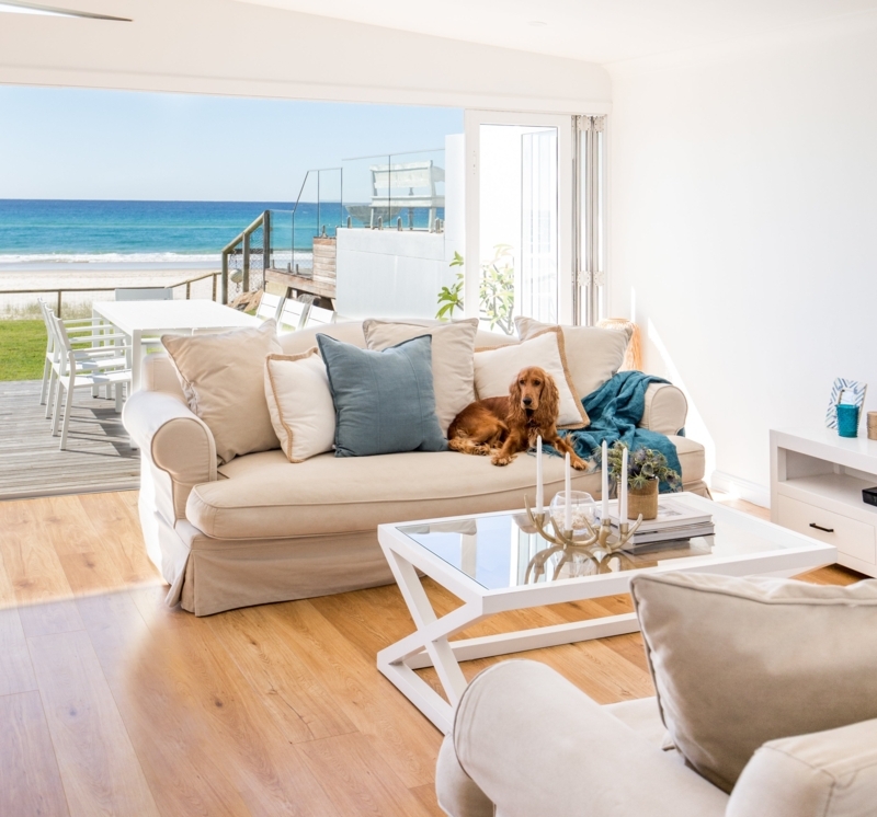Coastal Living Room with Beige Sofas and Ocean View