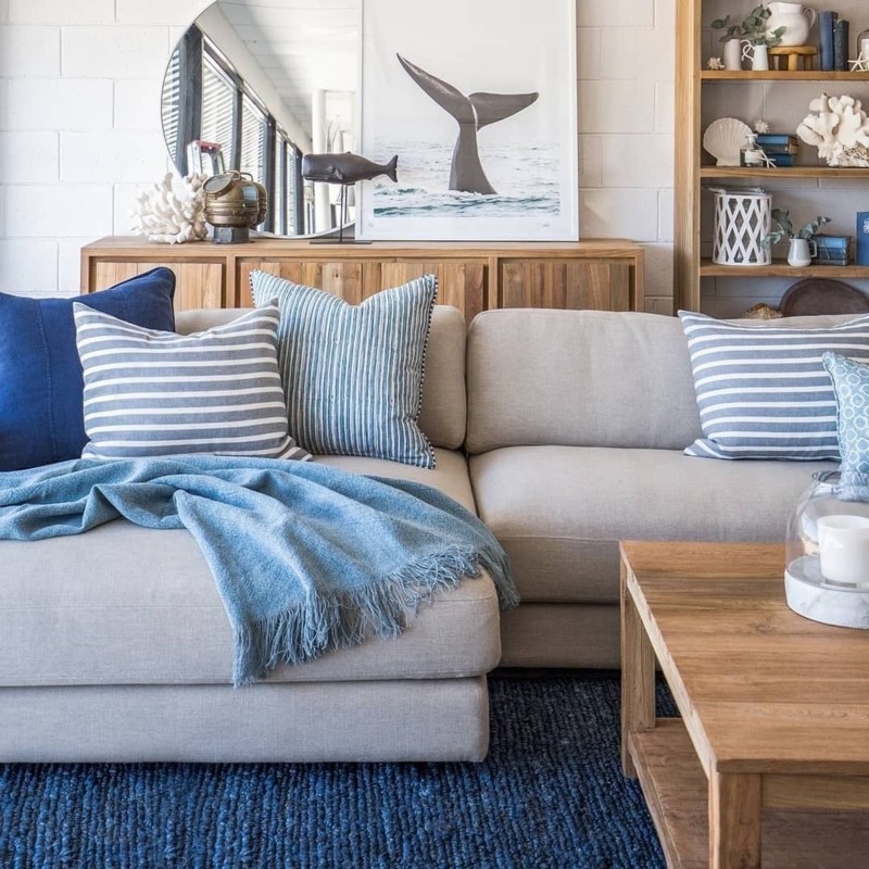 Coastal Living Room with Blue Accents and Wood Furniture