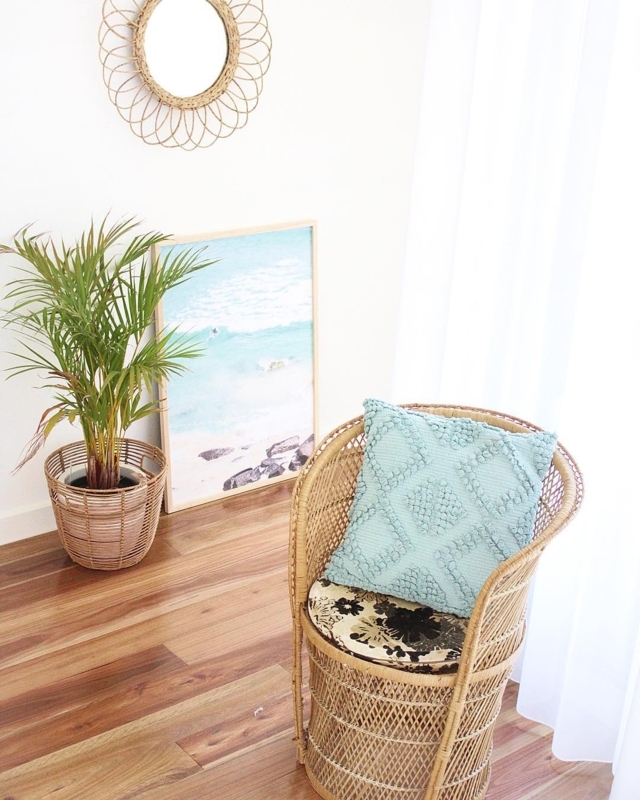 Coastal Rattan Accent Chair with Soft Blue Pillow