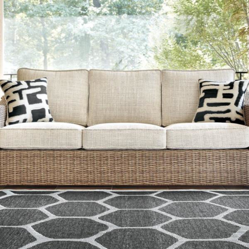 Coastal Wicker Sofa with Black Geometric Cushions