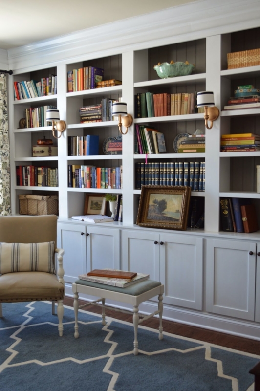 Cozy Library Bookcase with Wall Sconce Lighting