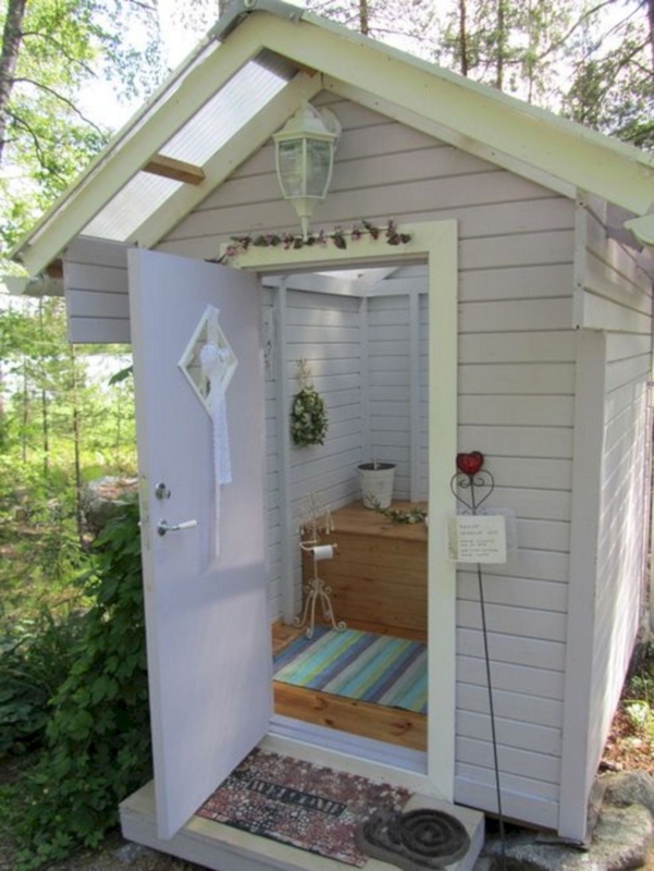 Cozy Outdoor Bathroom Shed with Rustic Charm