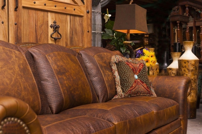 Cozy Rustic Brown Leather Sofa with Decorative Pillow