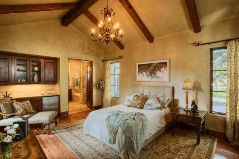 Cozy Spanish-Style Primary Bedroom with Rustic Beams