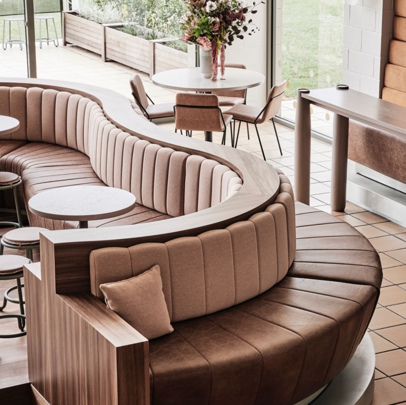 Curved Banquette Seating with Wood Accents