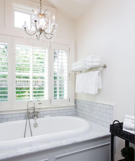 Elegant Bathroom Chandelier Above Freestanding Tub