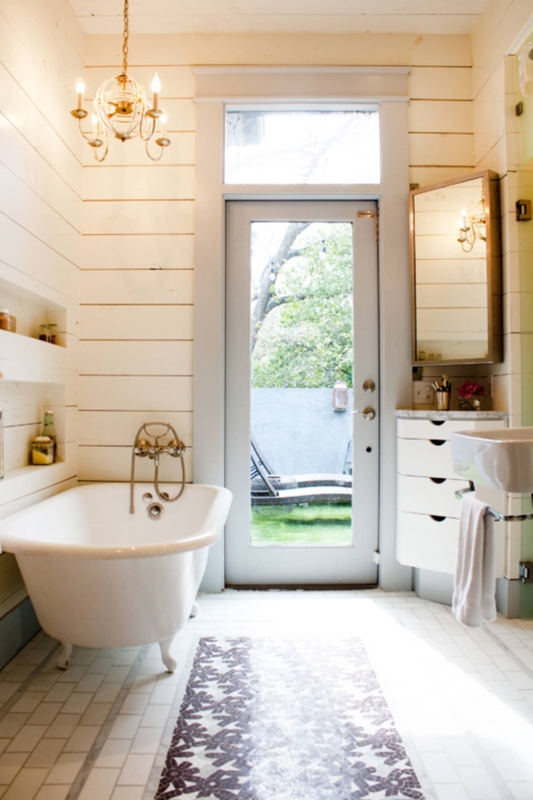 Elegant Bathroom with Chandelier and Natural Light