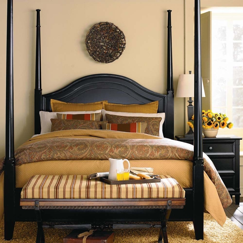 Elegant Black Queen Four Poster Bed in Cozy Bedroom