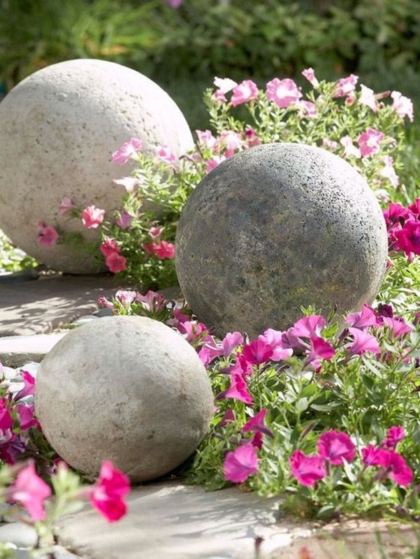 Elegant Concrete Garden Spheres with Pink Flowers