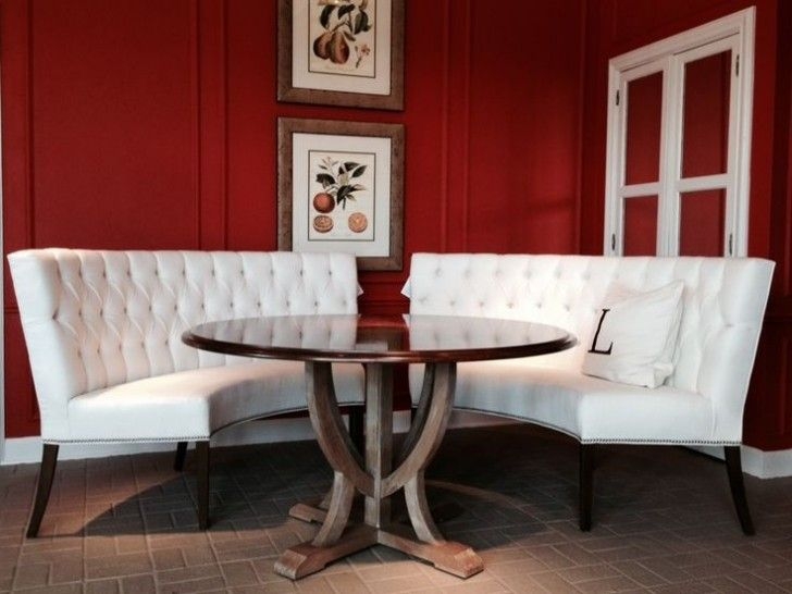 Elegant Curved White Banquette Seating with Round Table