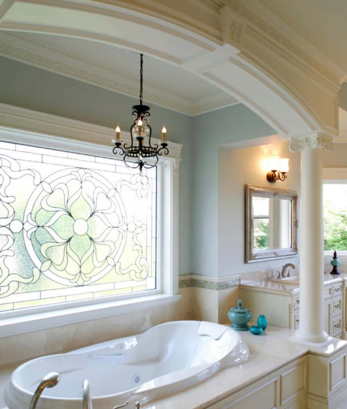 Elegant Primary Bathroom with Chandelier and Stained Glass