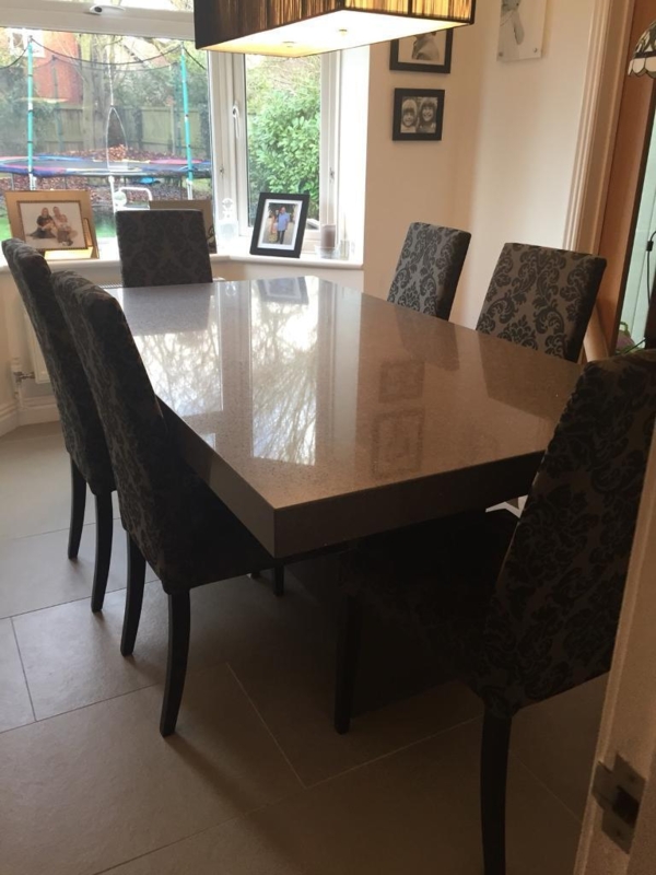 Elegant Quartz Dining Room Table with Patterned Chairs