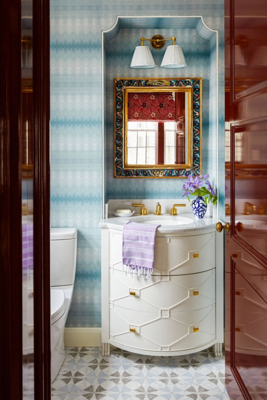 Elegant Small Bathroom with Mirror Wallpaper and Vanity