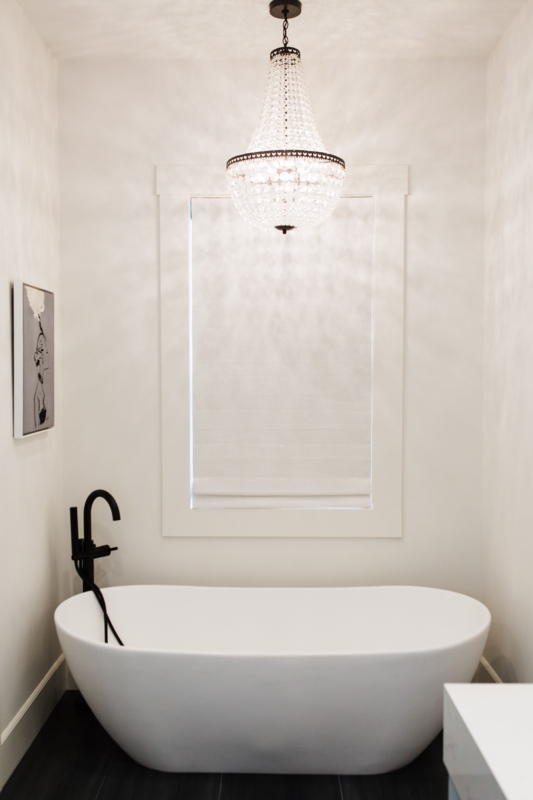 Elegant Soaker Tub with Crystal Chandelier Lighting