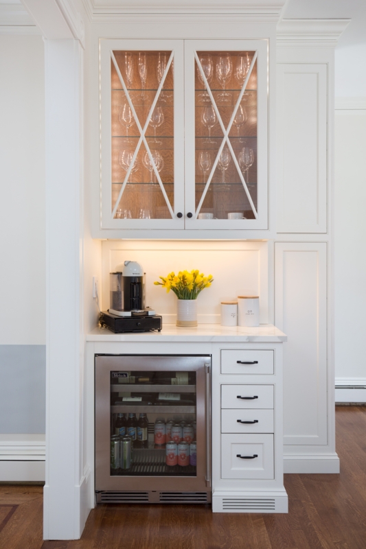 Elegant White Kitchen Bar with Lighted Glass Cabinet