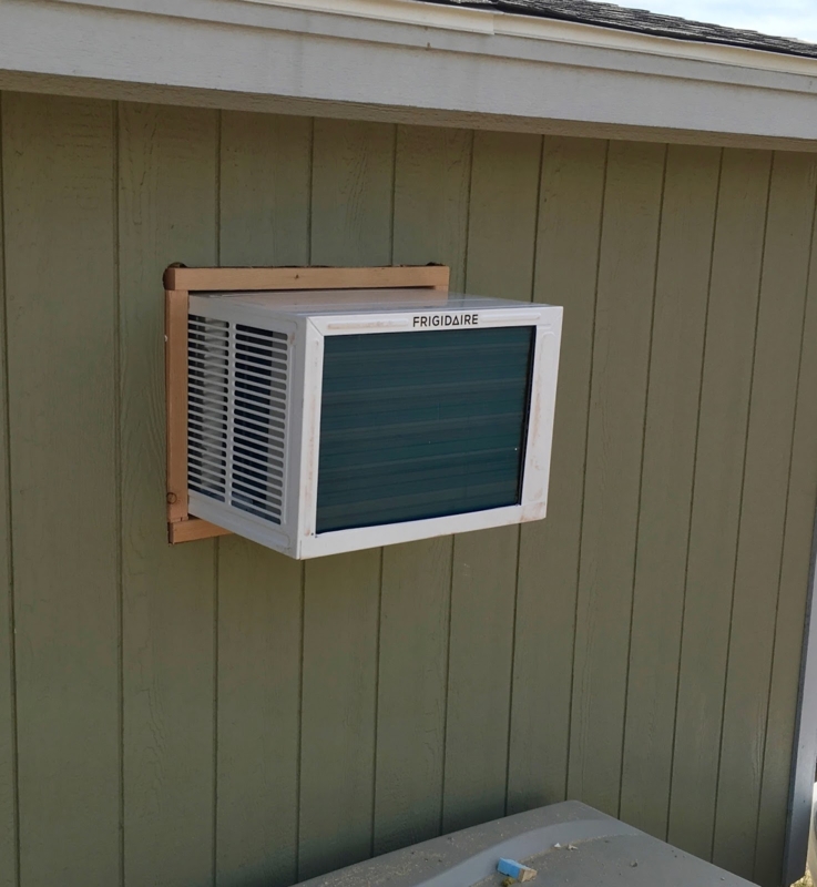 Frigidaire Window HVAC Unit Installed on Green Shed